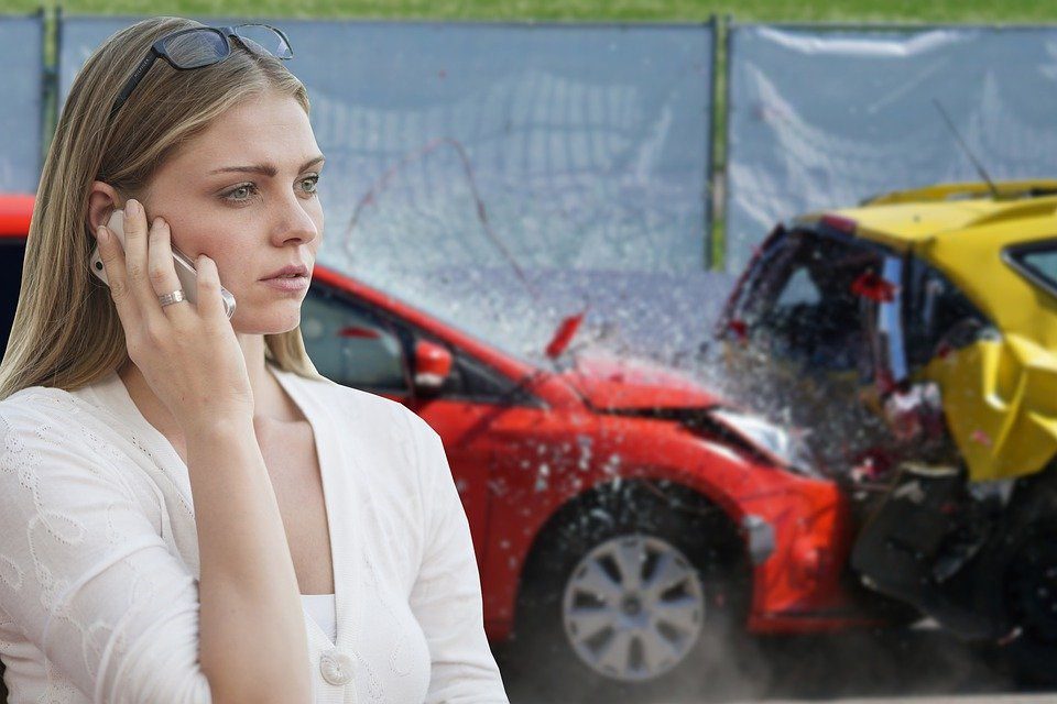 Woman on the phone after an accident