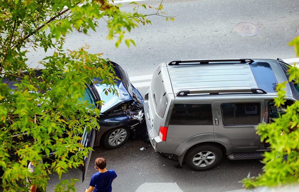 Car accident involving a sedan and minivan. Victims may file personal injury lawsuits seeking damages. 