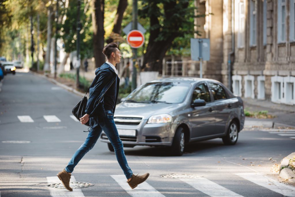 Pedestrian crossing in front of driver making left turn