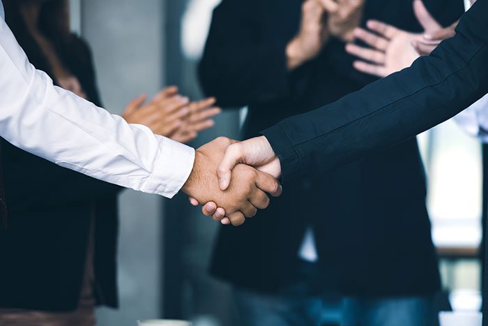 two people shaking hands