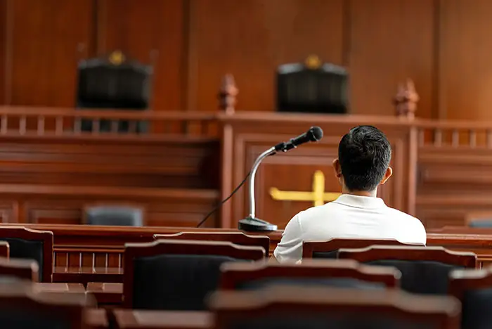 person sitting in courtroom