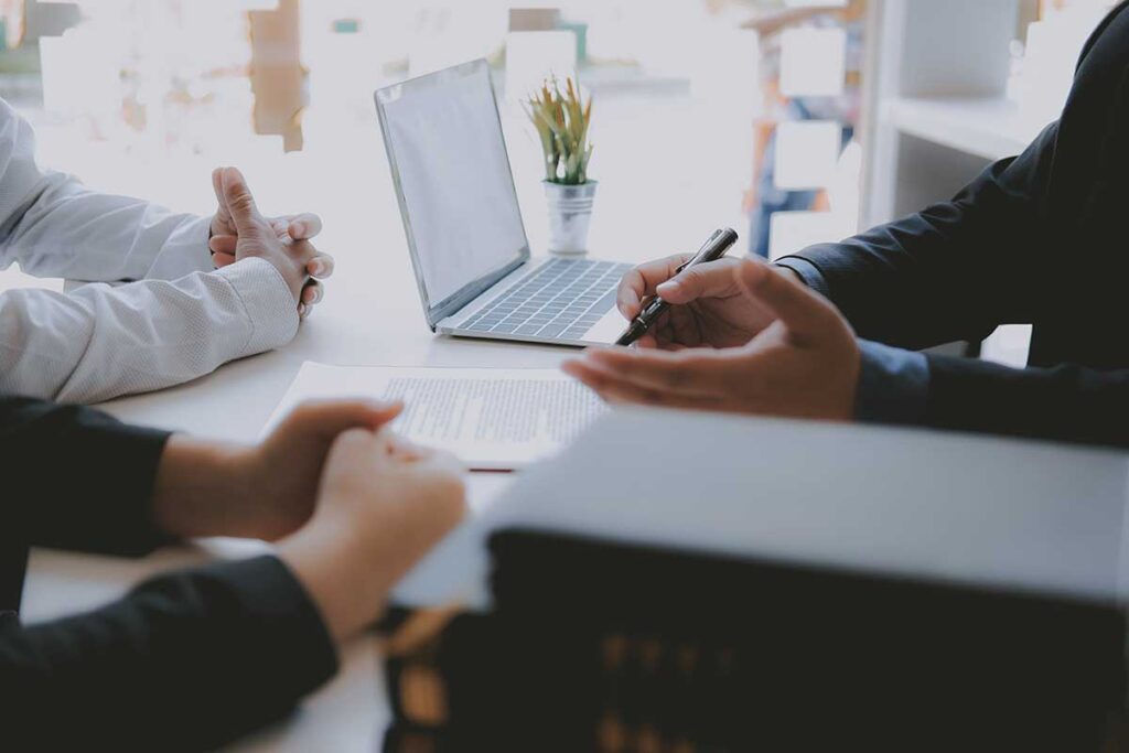 people discussing something at a desk