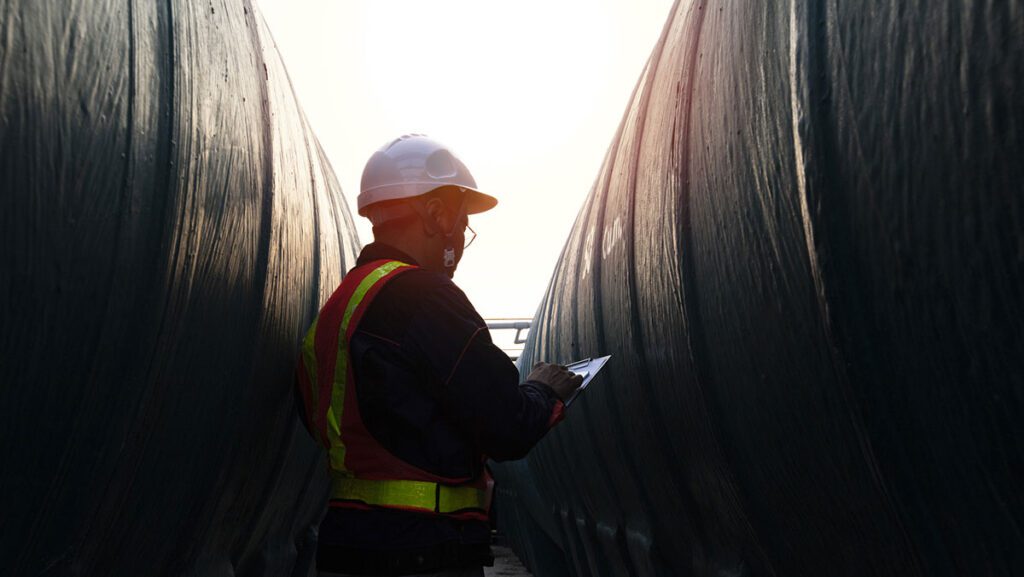 person taking notes at a job site