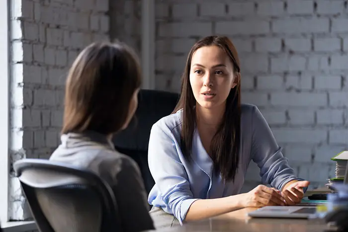 person consulting with attorney