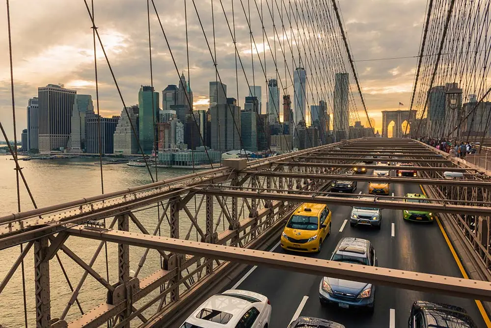 Cars driving over a bridge in NYC