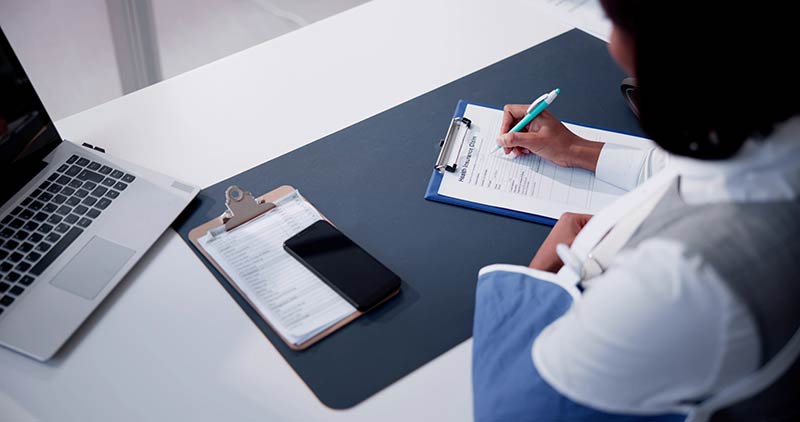 Person filling out workers comp claim in south carolina