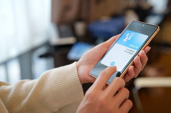 person receiving money transfer on their phone