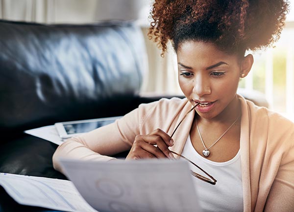 woman reading paperwork