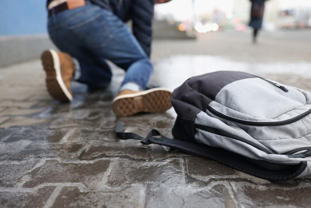 Person falling on a sidewalk